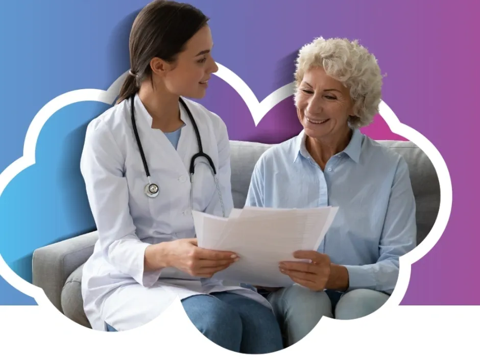 A doctor discussing medical documents with an elderly woman.